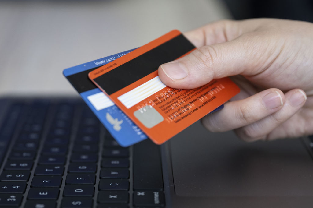 In this photo illustration credit cards are seen on a computer in Ankara, Turkiye on June 26, 2023.