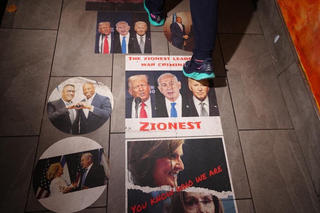 People stepping on the pictures at the restaurant.