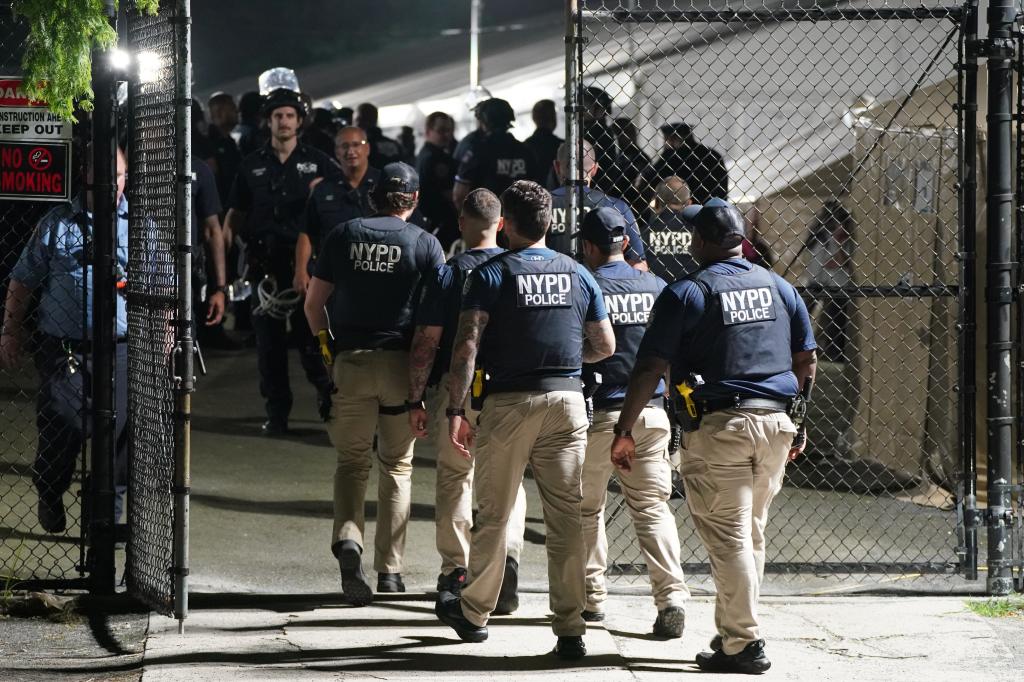 NYPD cops at the Randall's Island shelter. 