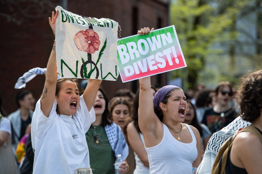 Pro-Palestinian protestors rally as they march around Brown University.