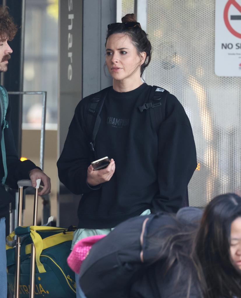 Olympian Rachael 'Raygun' Gunn and husband Samuel Free arriving at Sydney International Airport