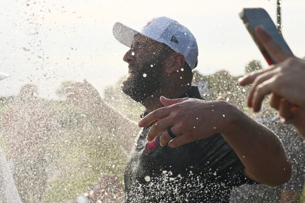 Jon Rahm celebrates after his tournament win on Sept. 15.