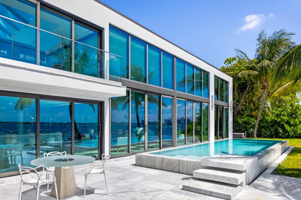 Palm trees and an infinity pool add to the home's wow factor 