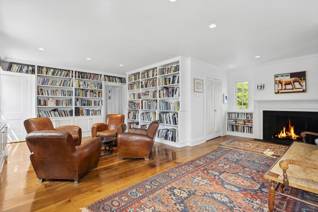 Built-ins and a fireplace adorn this library.