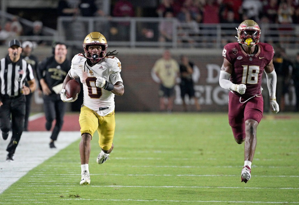 Boston College Eagles running back Treshaun Ward (0) runs the ball down the field past Florida State Seminoles linebacker Cam Riley (18) during the game at Doak S. Campbell Stadium.