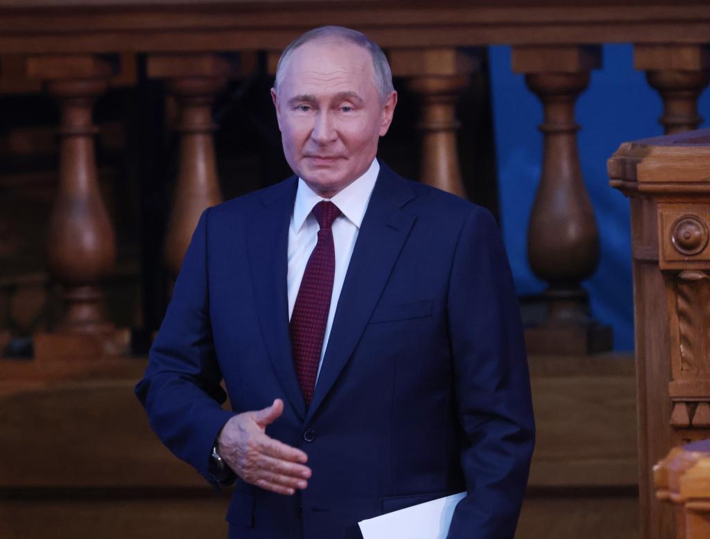 Russian President Vladimir Putin leaves the hall during the plenary session of the 4th Eurasian Women's Forum, at the Tauride Palace on September 18, 2024.