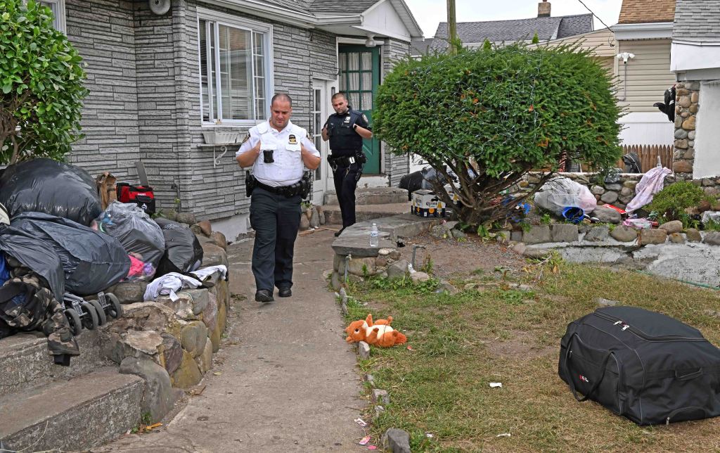 Police officers at the house where the fight started.