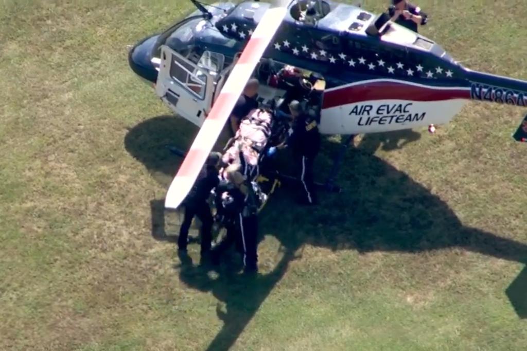 Helicopter and crowd of people outside Apalachee High School in Georgia following a reported school shooting on September 4, 2024.