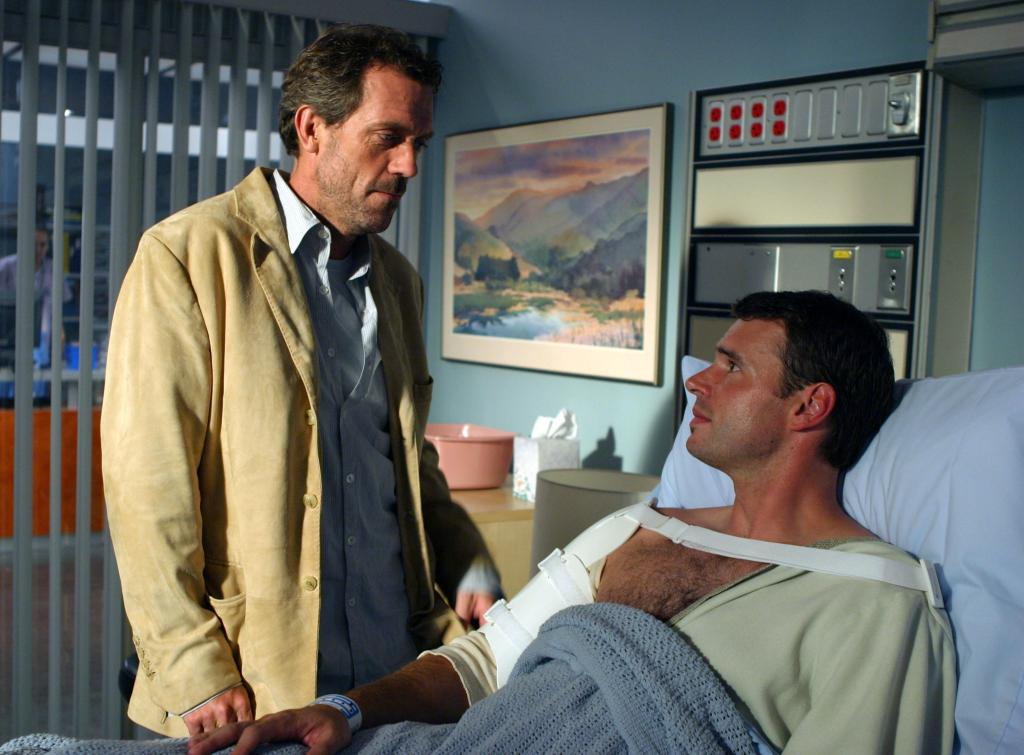 "House" (Hugh Laurie) and his baseball player patient, Hank Wiggen (Scott Foley.)