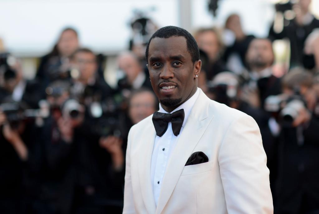 Sean Combs in a white suit attends the 'Killing Them Softly' Premiere at the 65th Annual Cannes Film Festival, France.