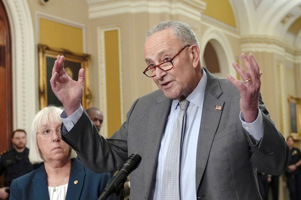 Sen. Majority Leader Chuck Schumer, D-N.Y., right, talks after a policy luncheon on Capitol Hill Tuesday, Sept. 24, 2024, in Washington.