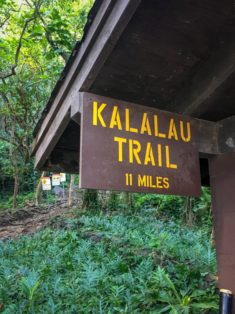 Sign at the starting point of Kalalau Hiking Trial along the Hawaiian island of Kauai, 