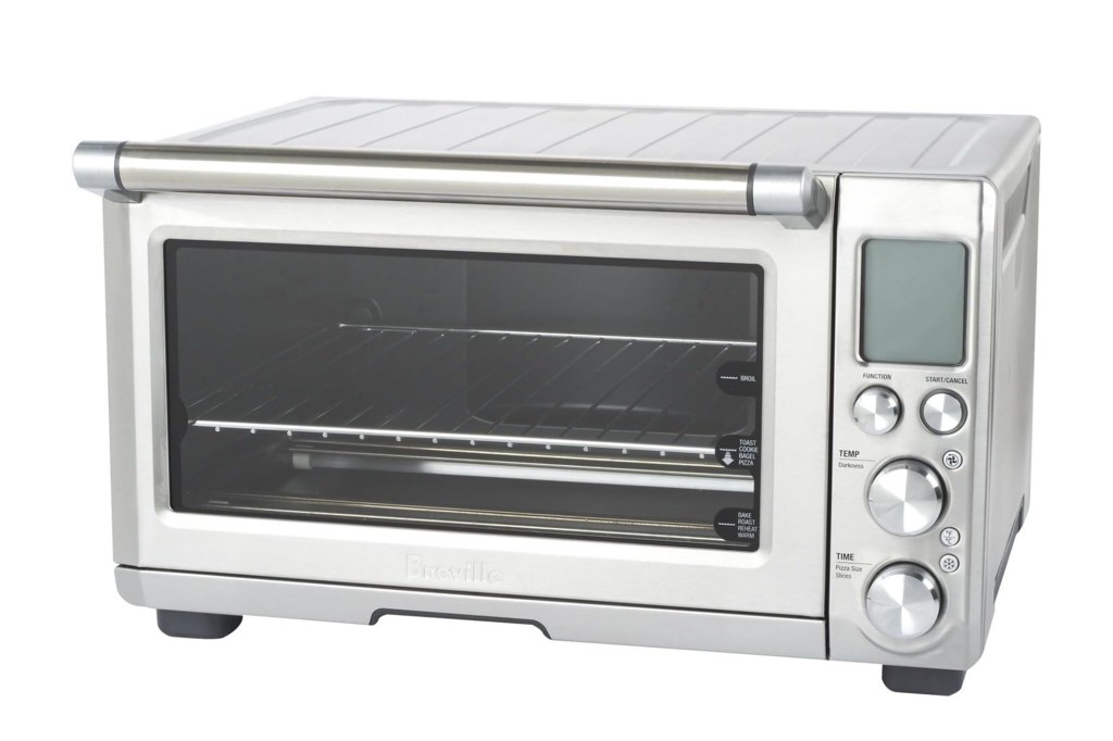 A silver toaster oven with a glass door