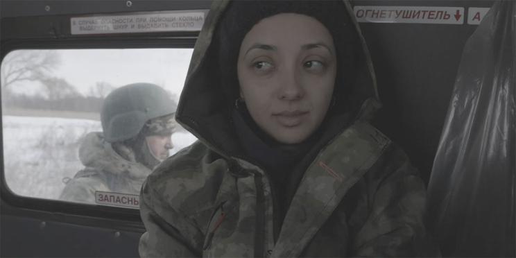 Anastasia Trofimova, the director and cinematographer of 'Russians at War,' wearing a military jacket in the film, which premiered at the Toronto International Film Festival