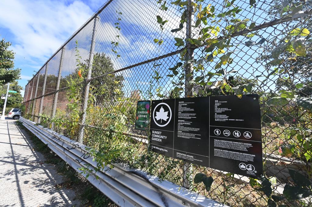 A photo showing the Parks Department sign outside the Sunset Community Garden.