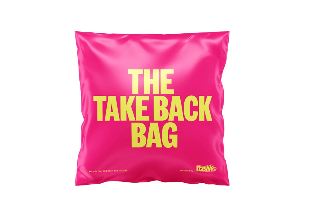 A pink pillow with yellow text