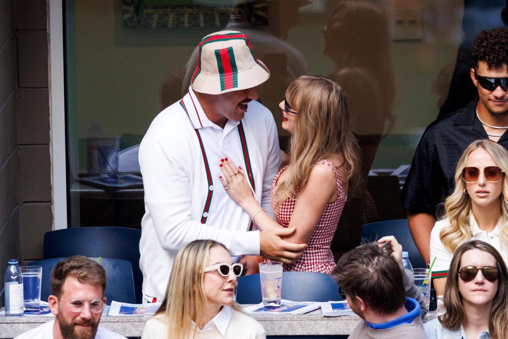 Travis Kelce and Taylor Swift kiss during the U.S. Open on Sept. 8, 2024.