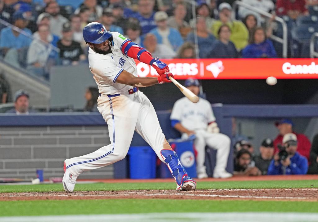 Toronto Blue Jays first baseman Vladimir Guerrero Jr. (27) hits a double against the Philadelphia Phillies during the eighth inning at Rogers Centre. 