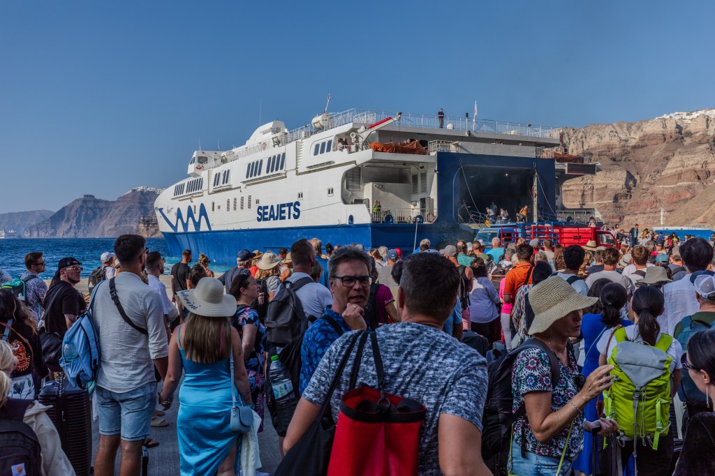 A large group of tourists arriving and departing at the port of Thira in Santorini, Greece on September 4th, 2023