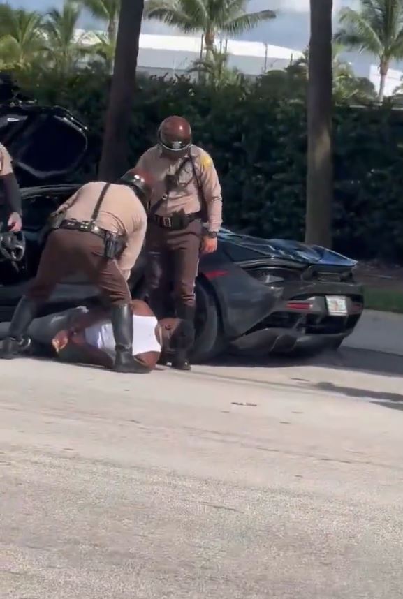 Tyreek Hill on the ground as he's handcuffed by police on Sept. 8, 2024.