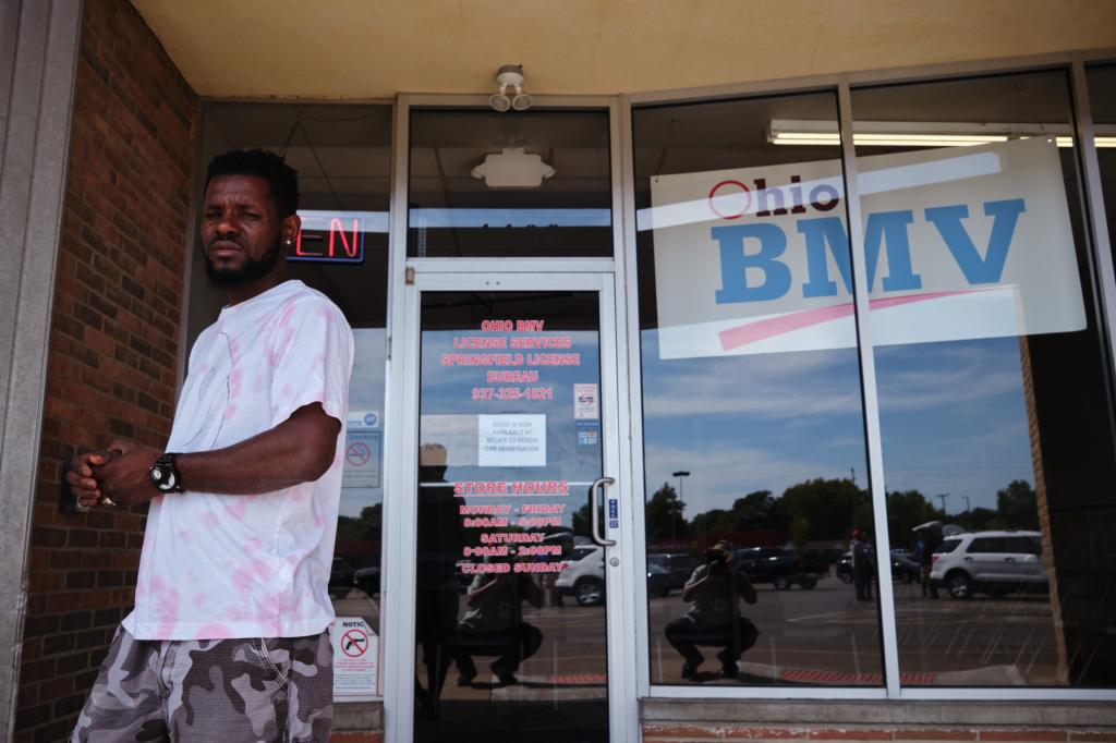 A US permanent resident from Haiti came to the Bureau of Motor Vehicles to get a handbook for a commercial driver license on September 13, 2024 in Springfield, Ohio.