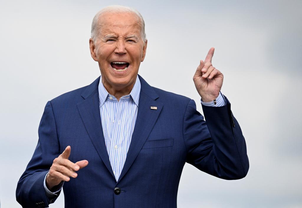 President Joe Biden gestures as he arrives at Detroit-Wayne County International Airport in Romulus, Michigan, U.S., September 6, 2024.