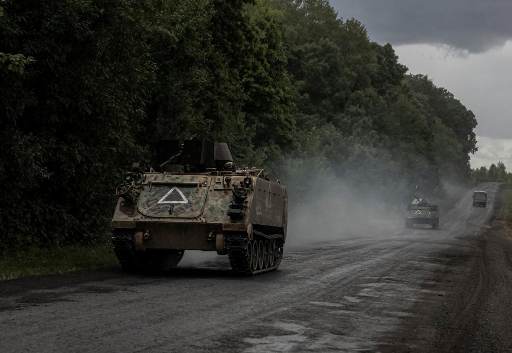 Ukrainian soldiers riding armored personnel carriers near the Russian border in Sumy region, during the ongoing war with Russia in August 2024