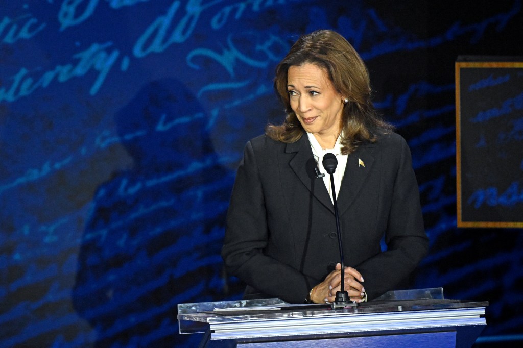 US Vice President and Democratic presidential candidate Kamala Harris listens as former US President and Republican presidential candidate Donald Trump speaks during a presidential debate at the National Constitution Center in Philadelphia, Pennsylvania, on September 10, 2024. 