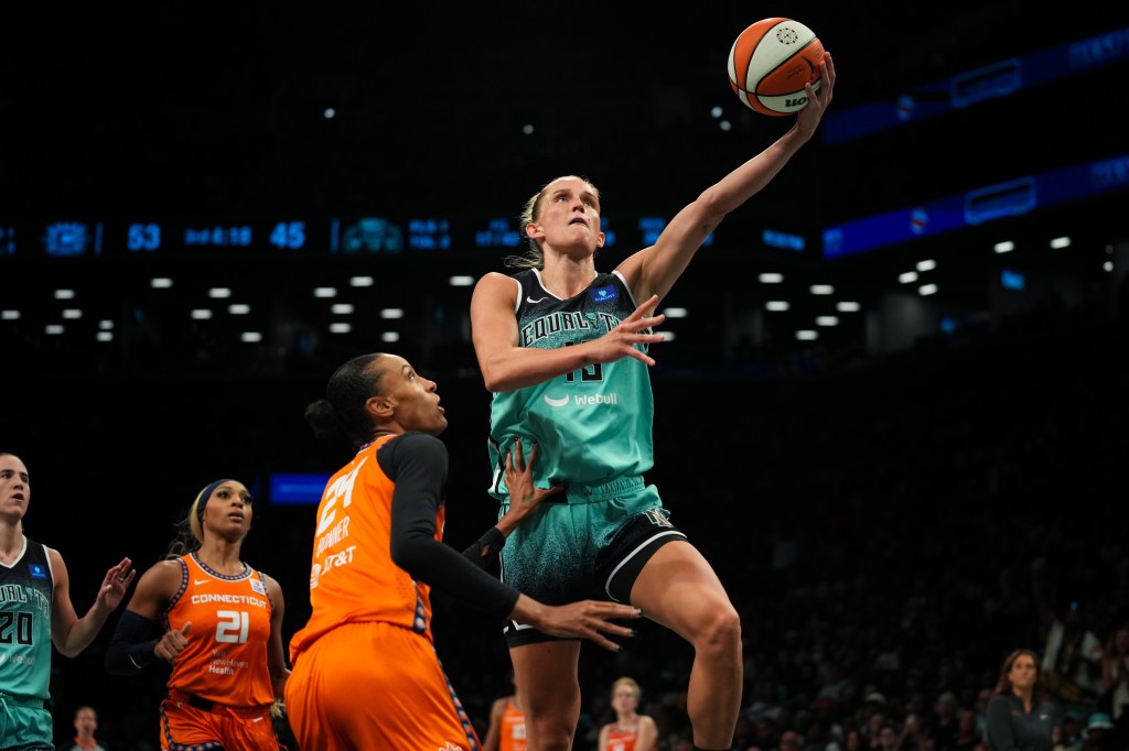 Leonie Fiebich #13 of the New York Liberty makes a layup in the second half of the game against the Connecticut Sun