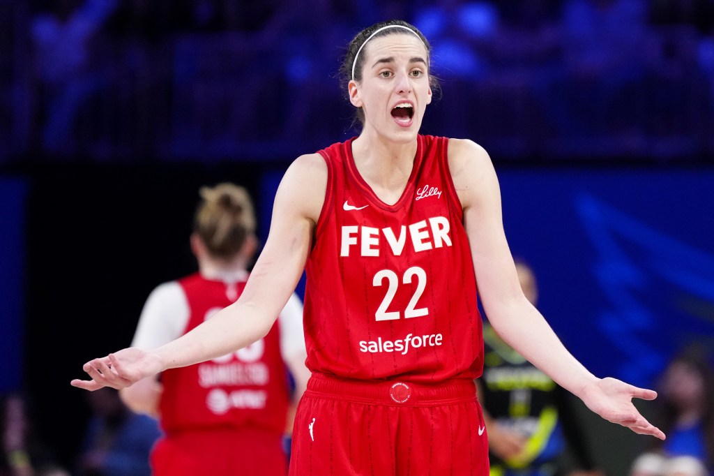 Caitlin Clark #22 of the Indiana Fever in red uniform reacting during a game against the Dallas Wings on September 1, 2024.