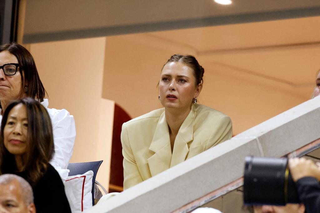 Russian former tennis player Maria Sharapova (C) watches Belarus's Aryna Sabalenka play against USA's Emma Navarro during their women's semifinals match on day eleven of the US Open tennis tournament at the USTA Billie Jean King National Tennis Center in New York City, on September 5, 2024. 