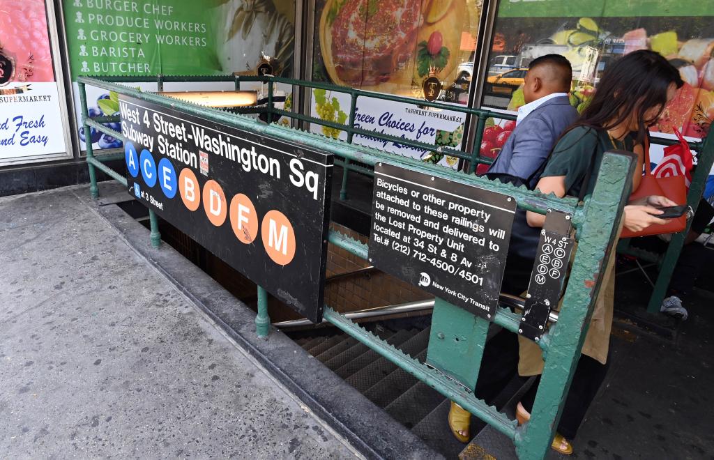 Photo shows the West 4th Street subway station.