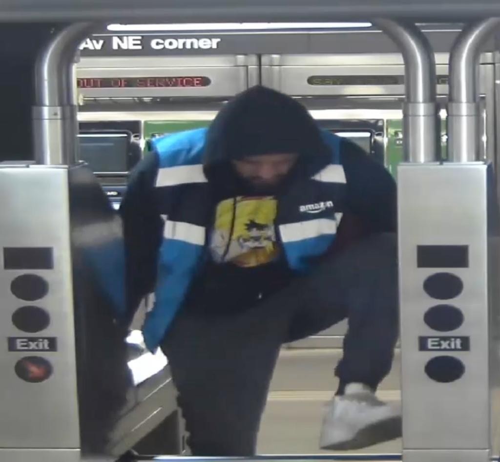 Another photo of the same suspect at a subway turnstile.