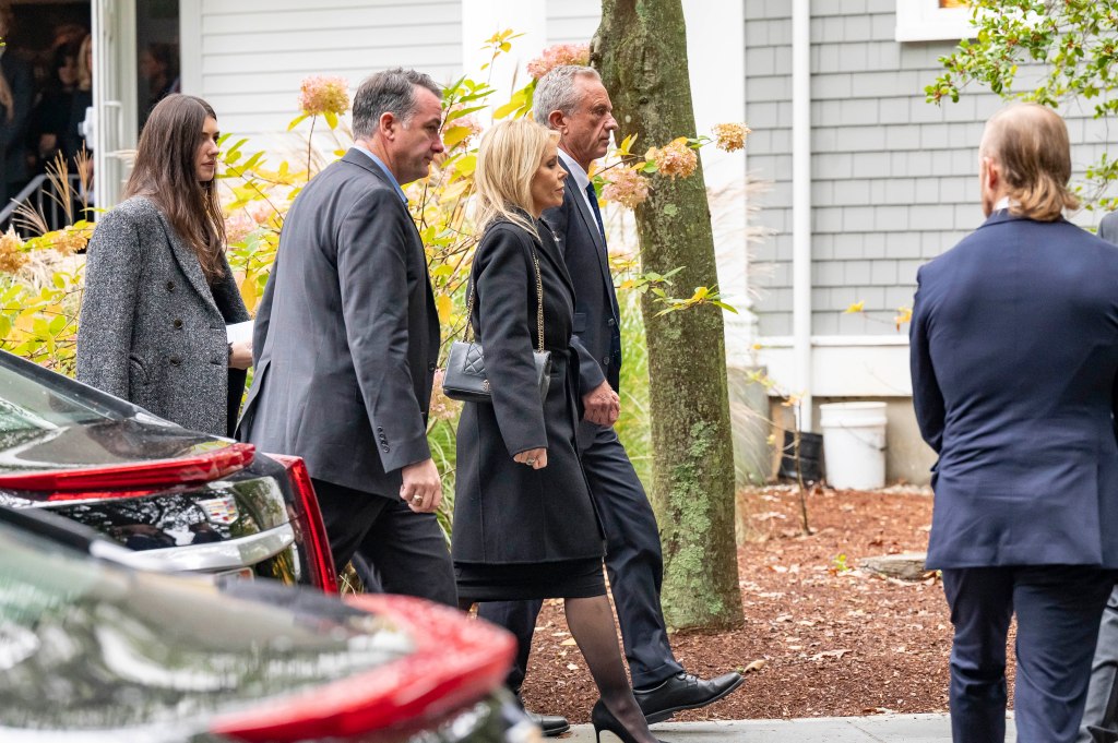 Robert F. Kennedy Jr. with his wife Cheryl Hines at his mother's funeral.