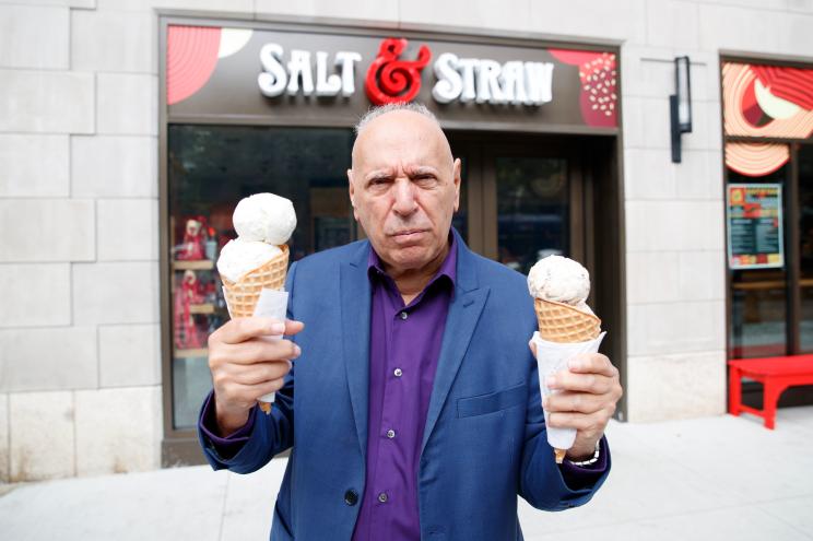 Steve Cuozzo standing in front of Salt & Straw holding two ice cream cones.