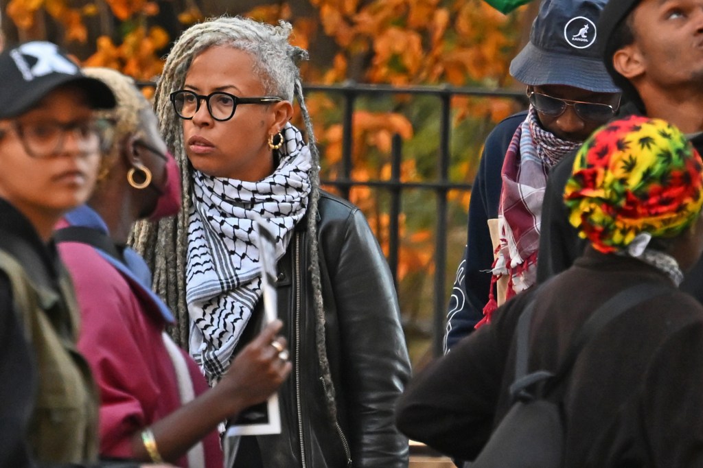 Shellyne Rodriguez with white and gray dreadlocks, protesting outside Manhattan Criminal Court alongside approximately 50 people over the murder of Jordan Neely.