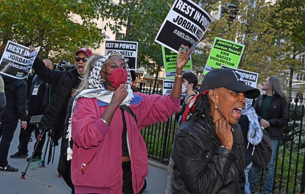 People protesting against Penny outside of Manhattan Criminal Court during jury selection on Oct. 21, 2024.