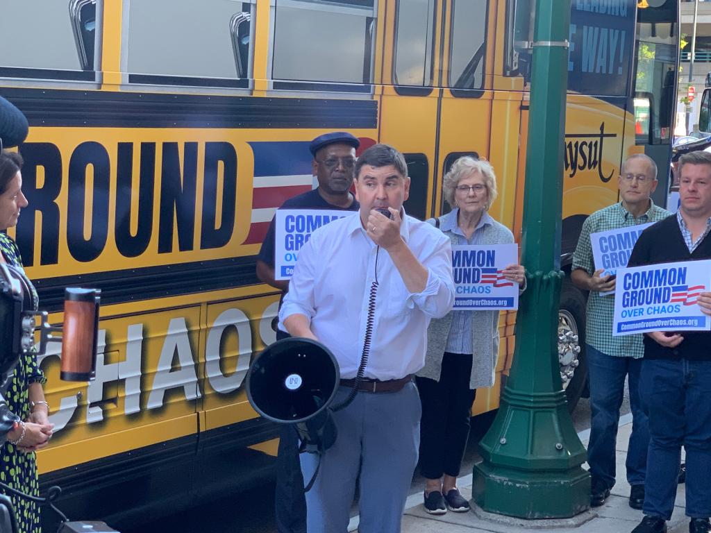 NYSUT's Common Ground Over Chaos bus tour in Syracuse NY  pictured speaking in white shirt is NY State Sen. John Mannion