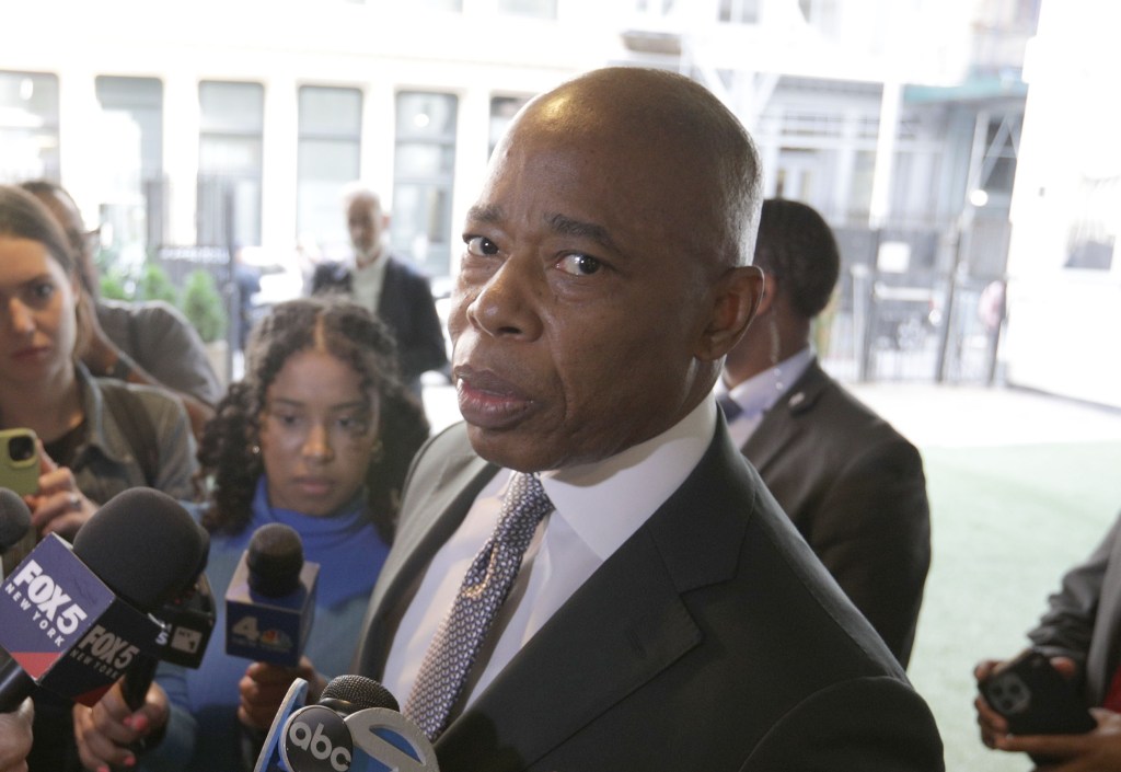 Mayor Eric Adams speaking to media outside a synagogue.