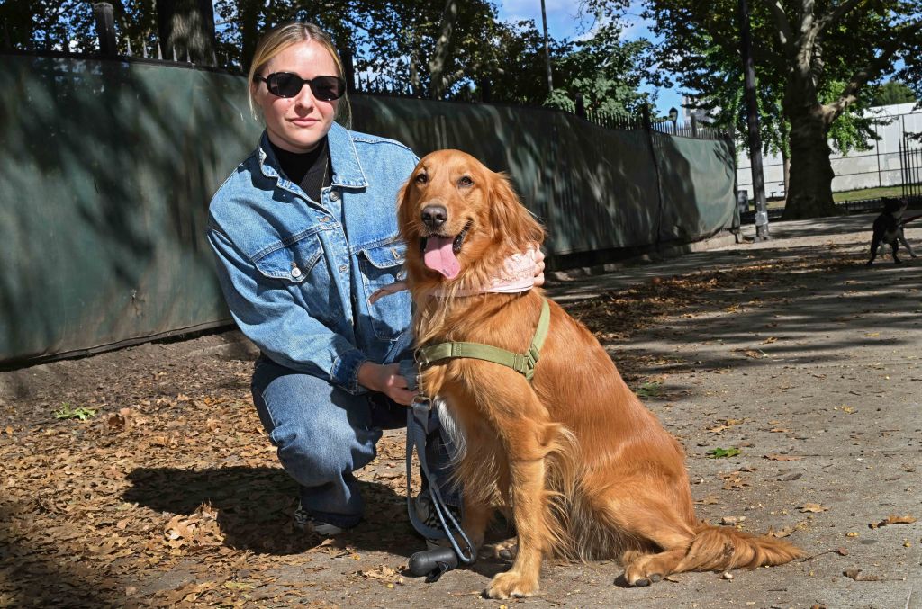 Katie Booth with her Golden Retriever named Tula. 