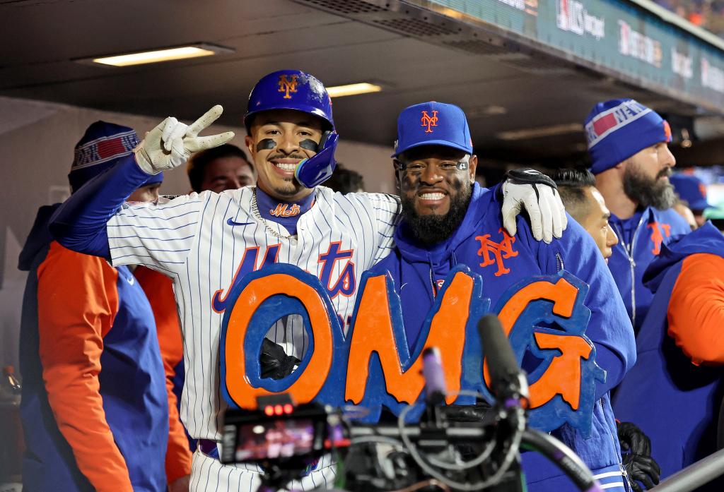 New York Mets third baseman Mark Vientos #27 poses with the OMG sign and New York Mets starting pitcher Luis Severino #40 in the dugout after he scores on his solo home run to tie the game during the first inning.