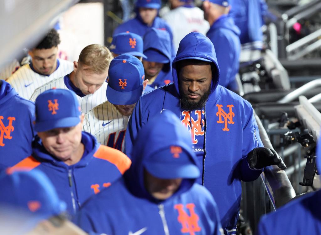 New York Mets starting pitcher Luis Severino #40 walks back into the clubhouse with his teammates after the final out of the 9th inning. 