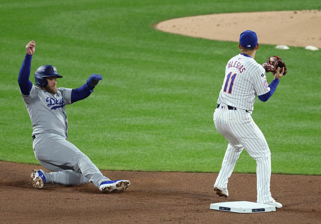 Max Muncy slides into second base during the Dodgers' win over the Mets on Oct. 17, 2024. 