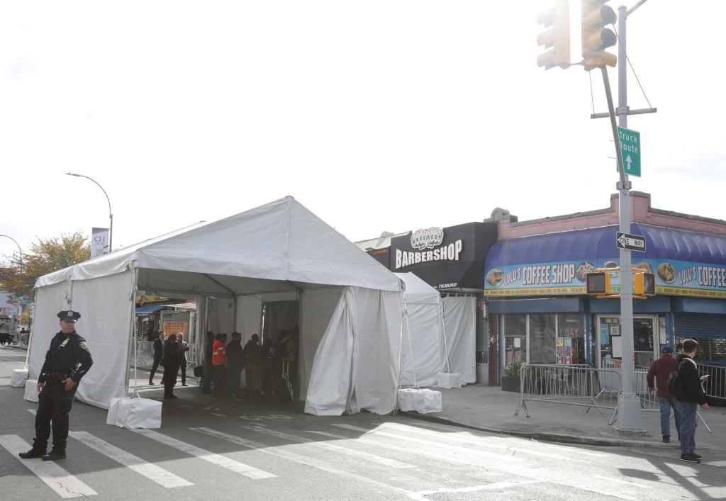 Showing a white tent on 1189 Castle Hill Avenue in the Bronx. Former President Donald Trump did visit the "Knockout" Barber shop to campaign, which put a big white Tent up to park his Car right  by the Shop for security