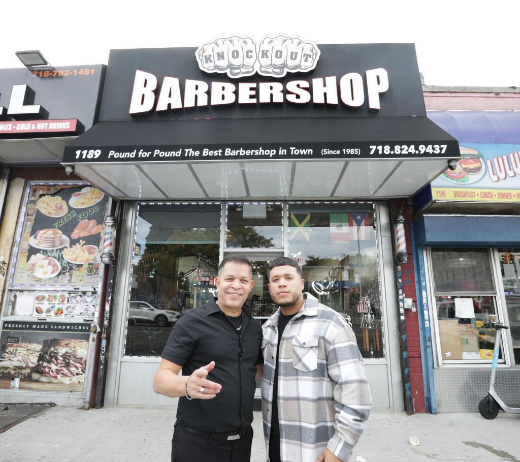 Showing left to right: the Barber Shop Owners Javiel Rodriguez sr. 59 years old and his son Javiel Rodriguez jr. 33years old. at their Barber shop, after Trump left, on 1189 Castle Hill Avenue in the Bronx, NY. 