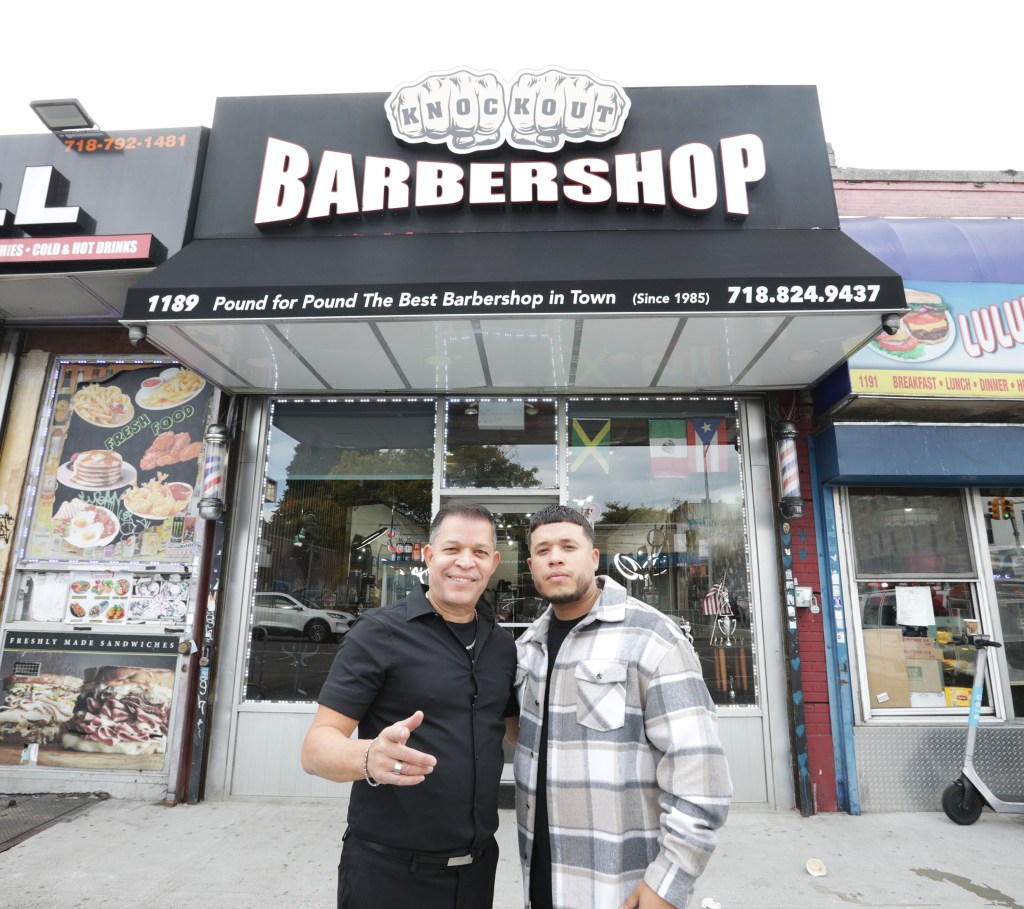 Showing left to right: the Barber Shop Owners Javiel Rodriguez sr. 59 years old and his son Javiel Rodriguez jr. 33years old. at their Barber shop, after Trump left, on 1189 Castle Hill Avenue in the Bronx, NY. 