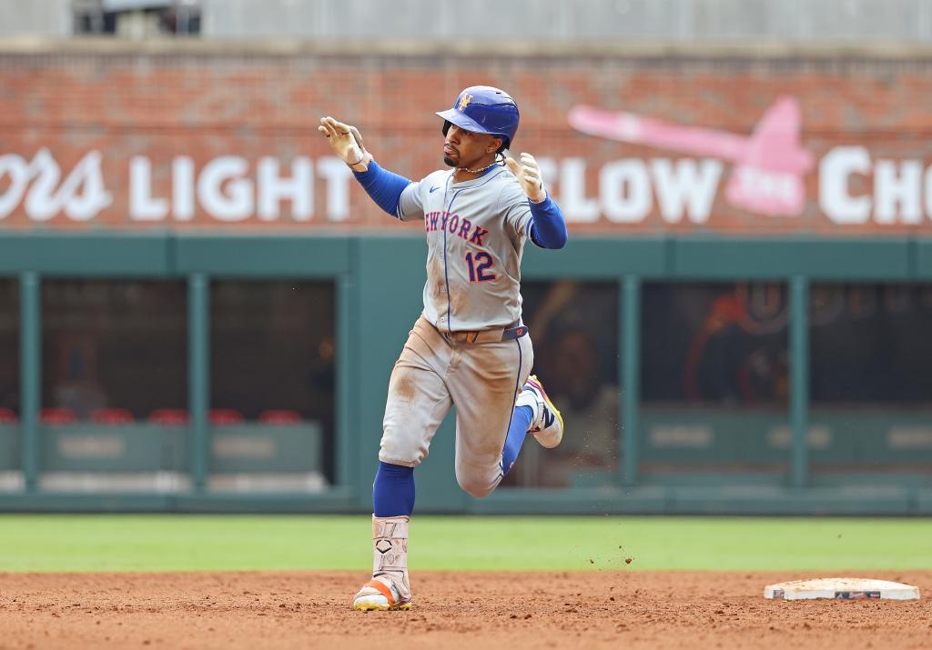 Francisco Lindor #12 of the New York Mets rounds the bases on his game winning two-run home run during the 9th inning. The New York Mets defeat the Atlanta Braves 8-7 to Clinch the wild card.