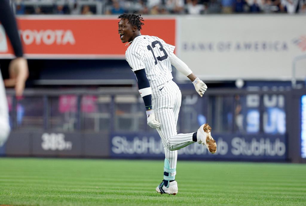 Jazz Chisholm Jr. #13 of the New York Yankees reacts after he hits a walk off RBI single in the 11th inning. The New York Yankees defeat the Kansas City Royals 4-3.