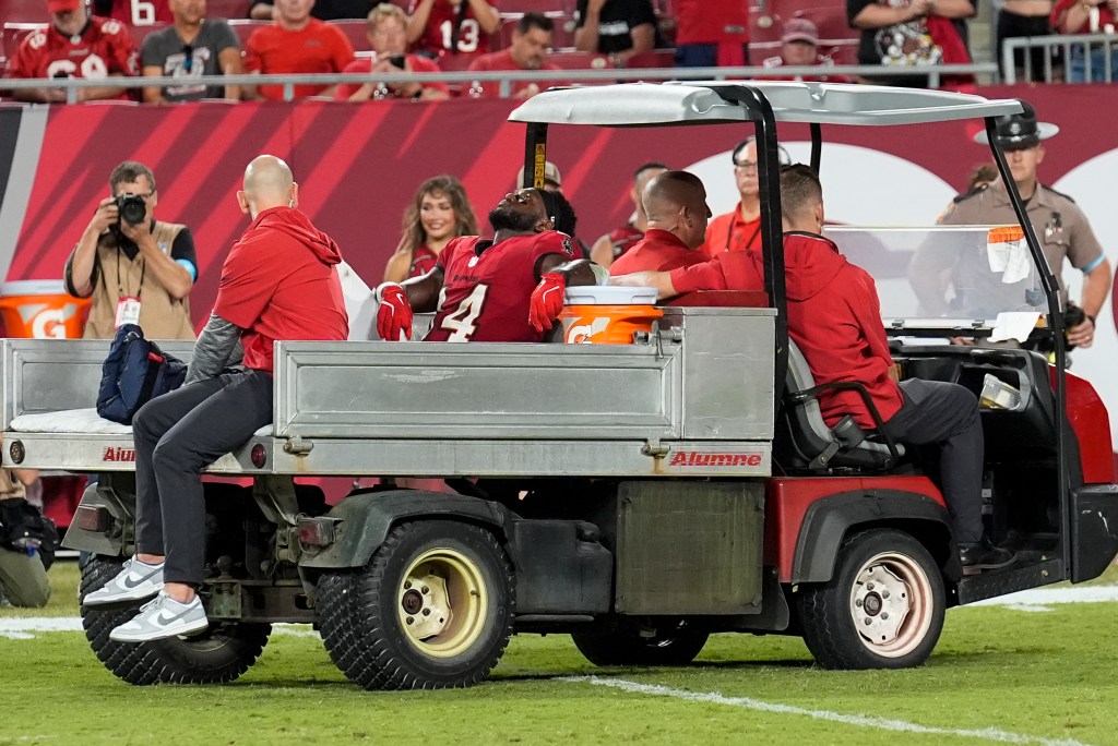 Chris Godwin is carted off the field during the Buccaneers' loss to the Ravens on Oct. 21, 2024. 