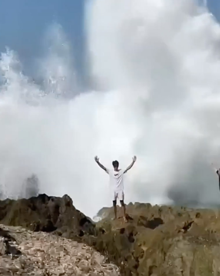 Screen grabs of the moments Roni is taken by a massive wave.